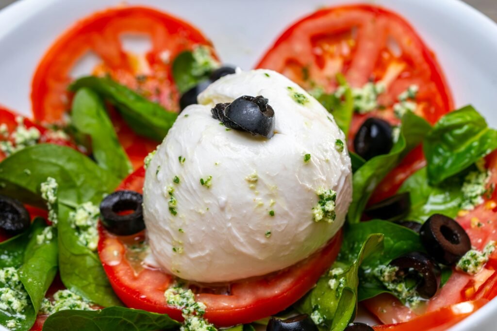 Why Salerno, the Amalfi Coast's Authentic Gem, Is 2026's Must-Visit Destination Delicious Caprese salad with mozzarella, tomatoes, and olives.